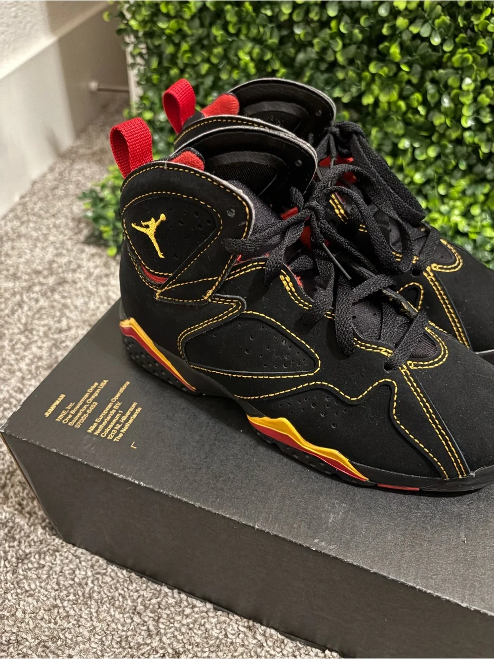 Jordan Kids Black Sneakers with Yellow & Red Accents